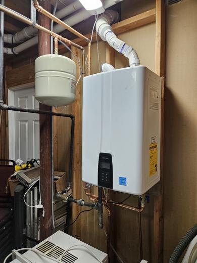 Tankless water heater installed by MJM